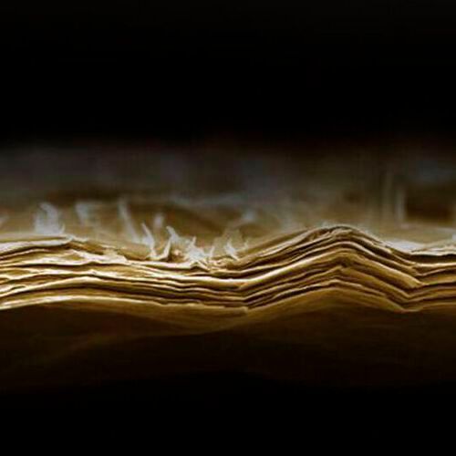 This SEM image shows an as-prepared lamellar membrane out of Mxene before exposure to water/light/heat. This SEM image shows an as-prepared lamellar membrane out of Mxene before exposure to water/light/heat.