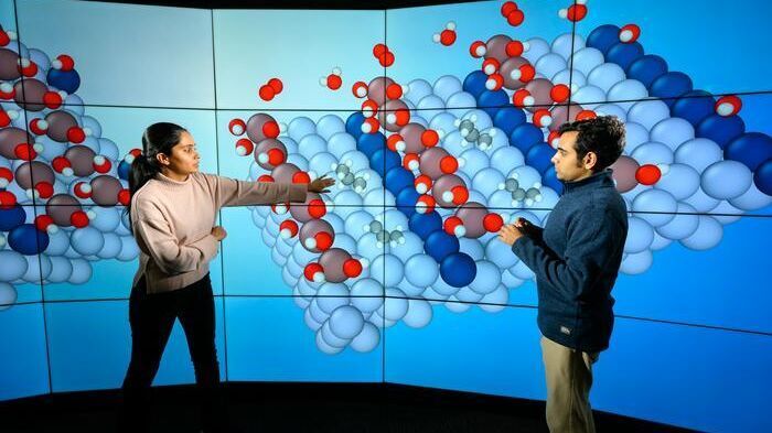 Assistant Professor Siddharth Deshpande and PhD student Snehitha Srirangam use data visualizations to reveal what happens on an atomic level when catalysts convert shale gas into polypropylene. The new algorithms they developed could lead to more efficient ways to create everyday products.(Source:  J. Adam Fenster / University of Rochester)