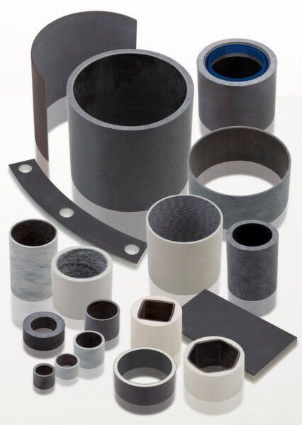 Plain bearings made of filled PTFE with a back made of continuously wound glass fibres, embedded in epoxy resin.  (GGB)