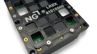 The casing for the radiation experiment made of the FDM material Antero 840CN03 with test samples for shielding radiation, including the tungsten-filled Stratasys material FDM Antero 800NA (dark gray) and the SL Somos PerFORM material (white). (Image:Stratasys)