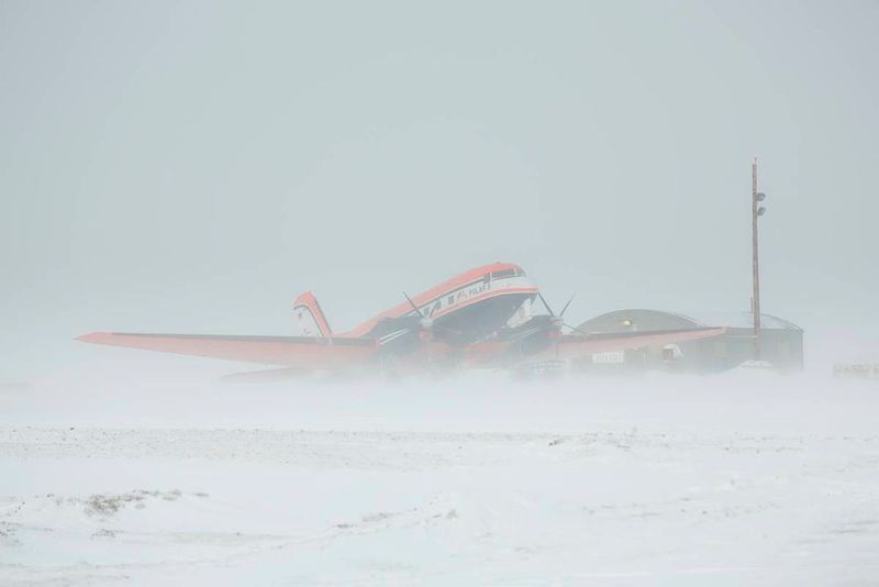 The German research aircraft Polar 5 at the Eureka Weather Station in driving snow.  (Stefan Hendricks)