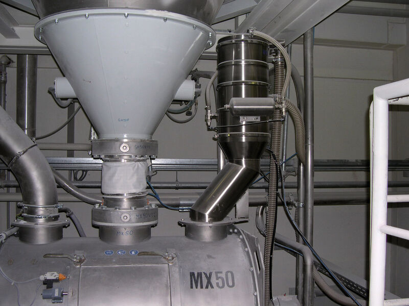 Vacuum conveyor (right) feeding powder into a mixer (Picture: Volkmann)