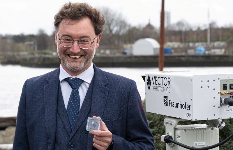 Dr. Richard Taylor, CEO and founder of Vector Photonics, with the PCSEL and the optical communication system during the successful demonstration across the River Clyde.(Image: Vector Photonics)
