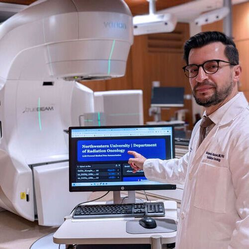 Study senior author Dr. Mohamed Abazeed demonstrates a prototype AI tool that summarizes cancer pathology reports, shown here in a radiation oncology setting. The tool, developed at Northwestern Medicine, is not yet in clinical use and is undergoing further testing.(Source:  Northwestern University)