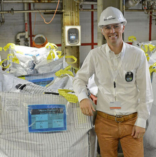 Natron Energy CEO Colin Wessells stands next to battery-grade Prussian blue at Arxada's facility in Visp, Switzerland.