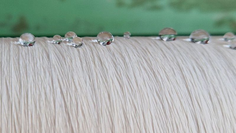 Thanks to plasma technology, organosilicon compounds have been successfully used to produce water-repellent textiles. (Source:  Empa)