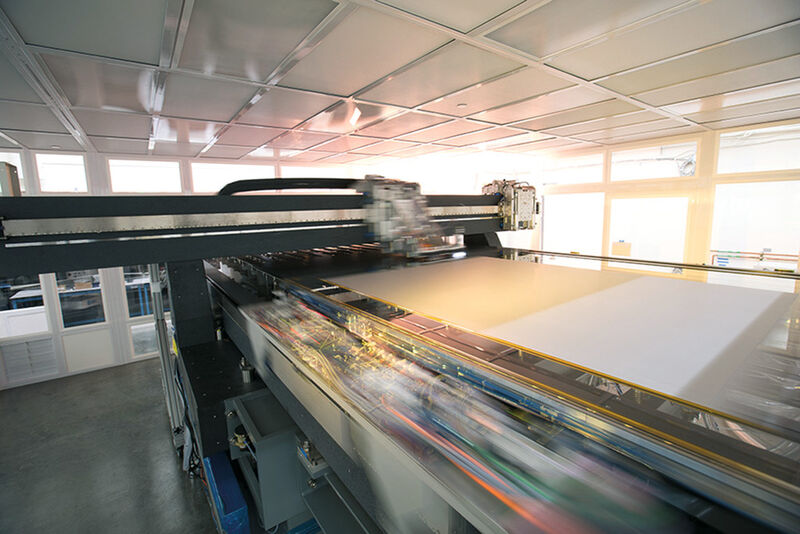 Kateeva's YIELDjet system is a massive version of an inkjet printer. Large glass or plastic substrate sheets are placed on a long, wide platform. A head with custom nozzles moves back and forth, across the substrate, coating it with OLED and other materials.