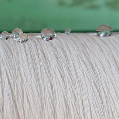 Thanks to plasma technology, organosilicon compounds have been successfully used to produce water-repellent textiles.  (Source: Empa)