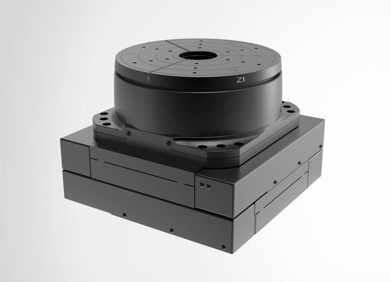 5DOF miniature XYZ-Phi-Delta positioning system (tripod on XY stage with aperture) for active alignment and assembly of optics. (Image:Steinmeyer Mechatronics)