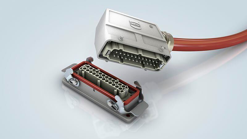 2013: Höchste Flexibilität und schnelle Prozesse sind für moderne Plattformstrukturen in der industriellen Produktion unerlässlich. Dies bedarf dafür angepasster Steckverbinderlösungen, die für mehr als die bisher bekannten Steckzyklen ausgelegt sind. Die Steckverbinderserie Han-High-Temp wurde speziell für den Einsatz in Hochtemperatur-Applikationen entwickelt. Einsatzfälle sind hier unter anderem Heizelemente an Kunststoffspritzgussmaschinen. (Harting)