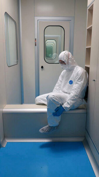 Worker on the way into the cleanroom.  (MG2)