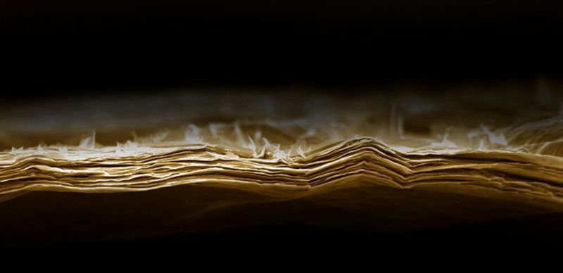 This SEM image shows an as-prepared lamellar membrane out of Mxene before exposure to water/light/heat. (Kaust 2020)
