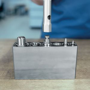 The new guide bush with male thread, with collar E 5708 makes the installation and removal of round active parts with collar possible directly from the working plane. (Source:  Meusburger)