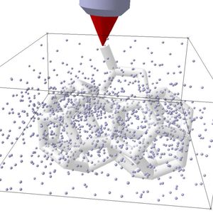 Ein Laser härtet das flüssige Material genau am Fokuspunkt aus.