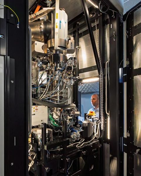 ORNL’s David Cullen stands in front of the new Thermo Scientific Spectra Ultra transmission electron microscope.  (Source: ORNL/ Carlos Jones, U.S. Dept. of Energy)