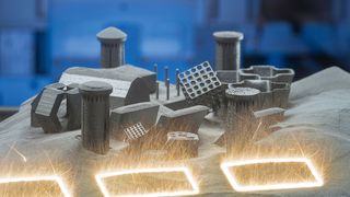 3D-Druck: Funkenschlagend schmilzt der Laser das neue Bauteil aus dem Metallpulver. Gesteuert wird er von einem Computerprogramm. (Siemens)