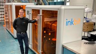 Inkbit SVP-Commercial Eric Bert reviewing the Saint-Gobain installation. (Source: Inkbit)