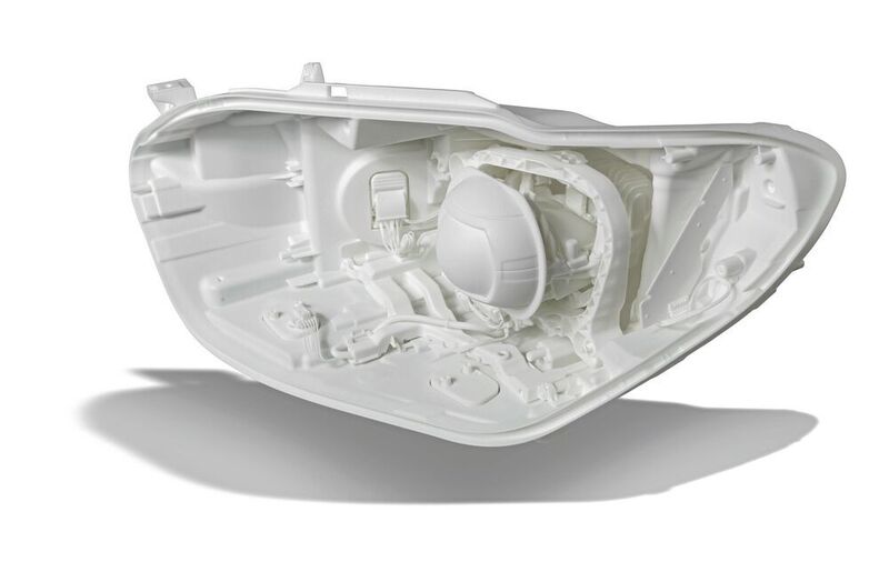 This car headlight housing was manufactured by laser sintering and surface-finished using the new FKM smooth process. (FKM Sintertechnik)