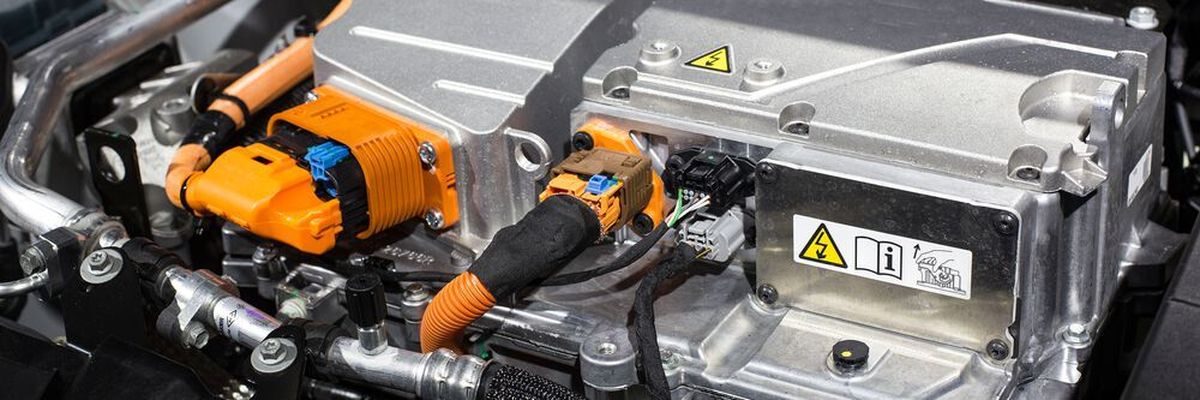 An electric motor uses electricity stored in batteries to power electromagnets which ultimately drive the vehicle axle.