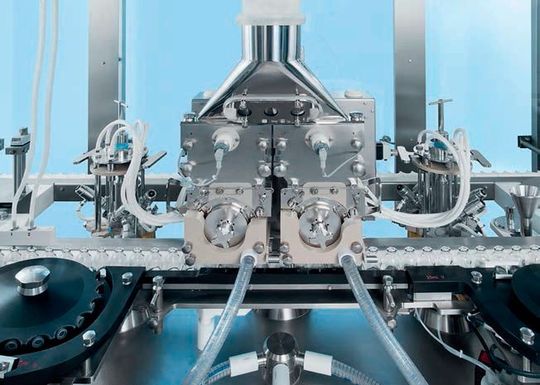 The heart of the line—the AFG 3020 filling machine safely fills the powdered drug into vials.