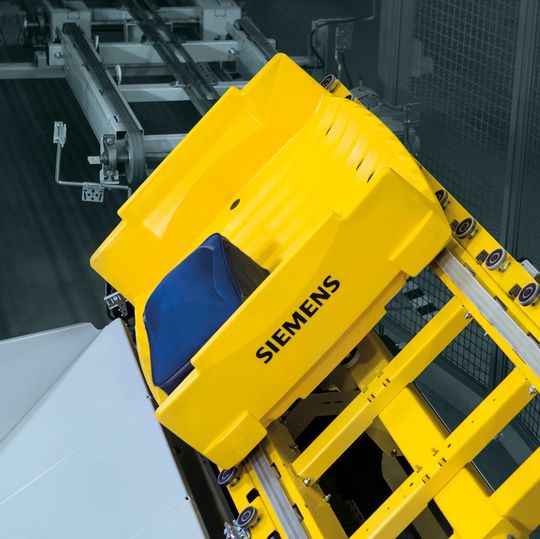 Semi-static tilter von Siemens als Teil einer Gepäckförderanlage. Semi-static tilter von Siemens als Teil einer Gepäckförderanlage.