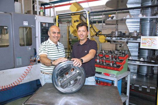 The Alumat engineers with an aluminium extrusion tool. The Alumat engineers with an aluminium extrusion tool.
