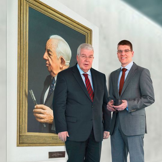 Dr Dieter Kress (President, left) and Dr Jochen Kress (Member of the Executive Board, right) in front of a painting of company founder Dr Georg Kress. Dr Dieter Kress (President, left) and Dr Jochen Kress (Member of the Executive Board, right) in front of a painting of company founder Dr Georg Kress.