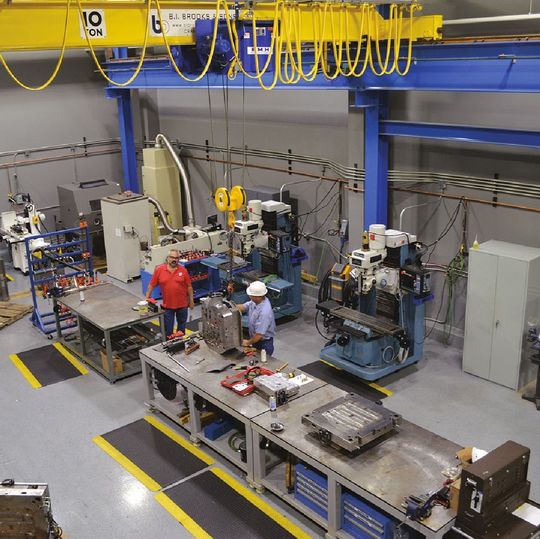 In addition to a 10-ton overhead crane, Henkel Richmond’s toolroom is outfitted with grinders, mills, lathes, EDMs, drill presses and a laser welder. In addition to a 10-ton overhead crane, Henkel Richmond’s toolroom is outfitted with grinders, mills, lathes, EDMs, drill presses and a laser welder.