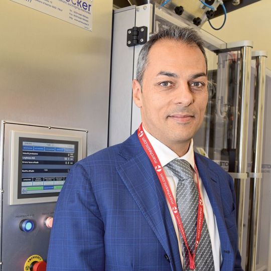 Sebastiano Nastasi, sales and technical director with Schmucker, with a stick packaging machine Sebastiano Nastasi, sales and technical director with Schmucker, with a stick packaging machine