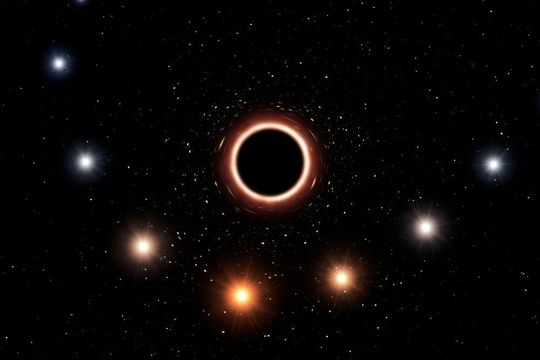 Die künstlerische Darstellung zeigt den Weg des Sterns S2, der sehr nah am supermassiven Schwarzen Loch in der Mitte der Milchstraße vorbeiführt. Das sehr starke Gravitationsfeld bewirkt, dass sich die Farbe des Sterns leicht zum Rot hin verschiebt, ein Effekt von Einsteins allgemeiner Relativitätstheorie. Zur besseren Übersichtlichkeit wurden in dieser Grafik wurden Farbeffekt und Größe der Objekte übertrieben dargestellt Die künstlerische Darstellung zeigt den Weg des Sterns S2, der sehr nah am supermassiven Schwarzen Loch in der Mitte der Milchstraße vorbeiführt. Das sehr starke Gravitationsfeld bewirkt, dass sich die Farbe des Sterns leicht zum Rot hin verschiebt, ein Effekt von Einsteins allgemeiner Relativitätstheorie. Zur besseren Übersichtlichkeit wurden in dieser Grafik wurden Farbeffekt und Größe der Objekte übertrieben dargestellt