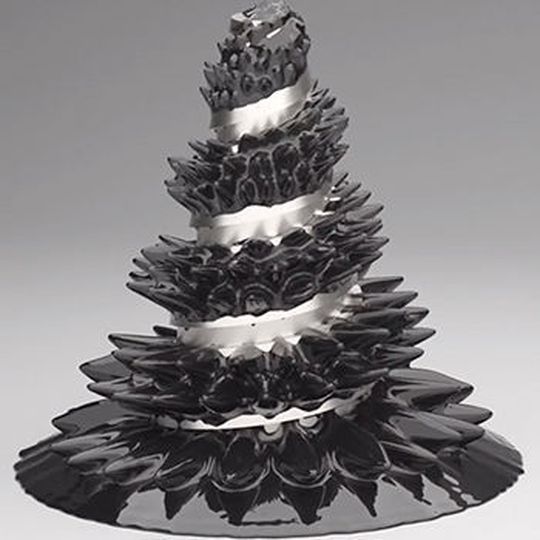 Simulation of ferrofluid literally climbing up a magnetized steel helix. Simulation of ferrofluid literally climbing up a magnetized steel helix.