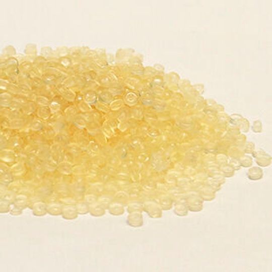 Pellets made from film that has had printing removed. Pellets made from film that has had printing removed.