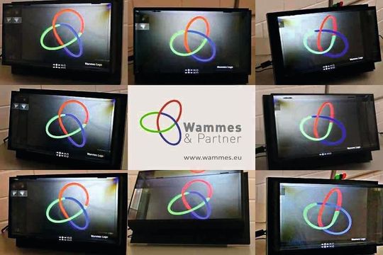 Unterschiedliche 2D-Ansichten aus verschiedenen Blickwinkeln derselben Darstellung des 3D-Unternehmenslogos in einem 3D-Lichtfeld-Display. Unterschiedliche 2D-Ansichten aus verschiedenen Blickwinkeln derselben Darstellung des 3D-Unternehmenslogos in einem 3D-Lichtfeld-Display.