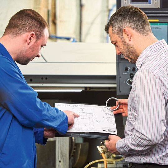 Grinding technician Kristian Folan (left) in discussion with HB Bearings technical director Darren Mawhinney. Grinding technician Kristian Folan (left) in discussion with HB Bearings technical director Darren Mawhinney.