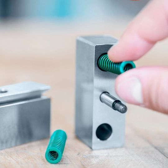 Spring-loaded strip guide, block-shaped Spring-loaded strip guide, block-shaped