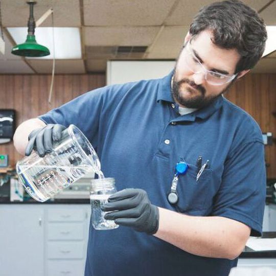 MFG Chemical lab scientist is testing to ensure there is no contaminant in the Dioctyl Sodium Sulfosuccinate (Doss) prior to shipment. MFG Chemical lab scientist is testing to ensure there is no contaminant in the Dioctyl Sodium Sulfosuccinate (Doss) prior to shipment.