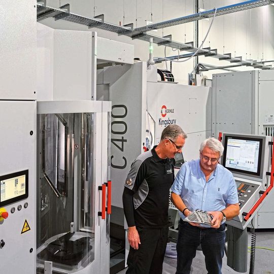 Kevin Fox with one of Norjon's machine operators in front of the Hermle C 400 HS Flex multi-pallet cell at Gosport. Kevin Fox with one of Norjon's machine operators in front of the Hermle C 400 HS Flex multi-pallet cell at Gosport.