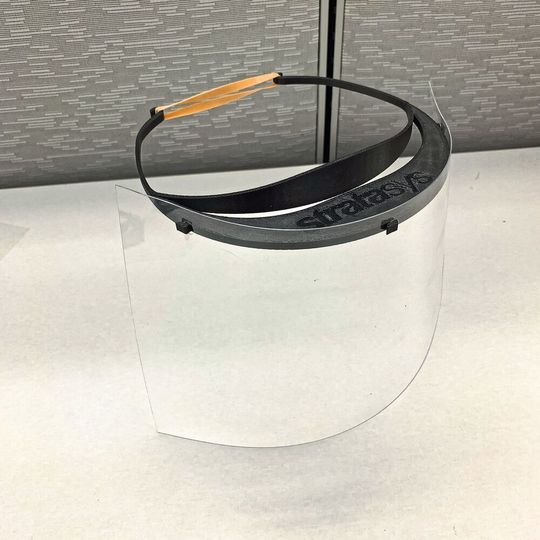 Stratasys and its partners are producing several thousand face shields with 3D-printed plastic frames. Stratasys and its partners are producing several thousand face shields with 3D-printed plastic frames.