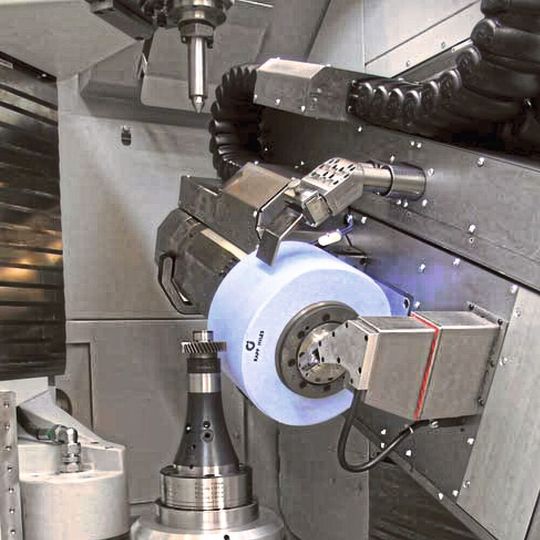 Workspace of a gear grinding machine. Very high rotational energy levels can arise in large grinding tools, such as those used for generation grinding. If a grinding wheel does burst, it can cause serious injury to the machine operator. Workspace of a gear grinding machine. Very high rotational energy levels can arise in large grinding tools, such as those used for generation grinding. If a grinding wheel does burst, it can cause serious injury to the machine operator.