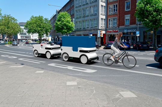 Der Zug folgt einem Mitarbeiter in den Zustellbezirk, dann vereinzeln sich die „Ducks“ und liefern ihre Waren autonom aus. Der Zug folgt einem Mitarbeiter in den Zustellbezirk, dann vereinzeln sich die „Ducks“ und liefern ihre Waren autonom aus.