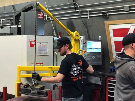 With the Sky Hook lifting device, employees are now able to safely work independently to perform critical lifts instead of team lifts. With the Sky Hook lifting device, employees are now able to safely work independently to perform critical lifts instead of team lifts.