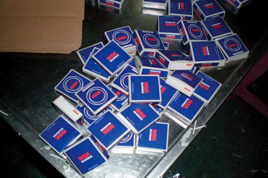 Fake NSK bearings in their packaging found at the production facility of a counterfeiter Fake NSK bearings in their packaging found at the production facility of a counterfeiter