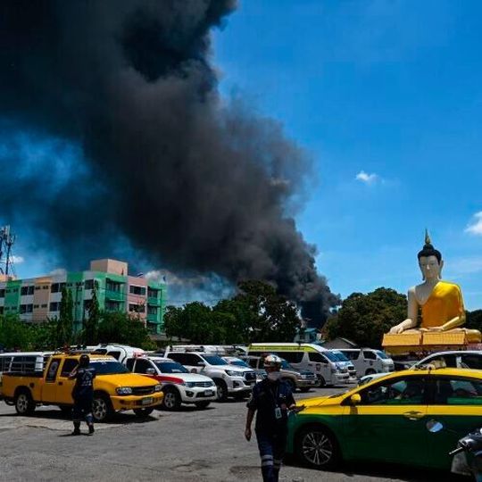 Thick black smoke billowed from the burning factory in Thailand after the fire was extinguished. Thick black smoke billowed from the burning factory in Thailand after the fire was extinguished.