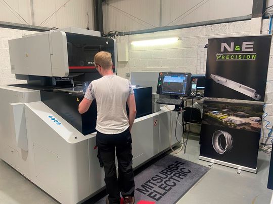 One of the Mitsubishi machines in action at N&E Precision. One of the Mitsubishi machines in action at N&E Precision.