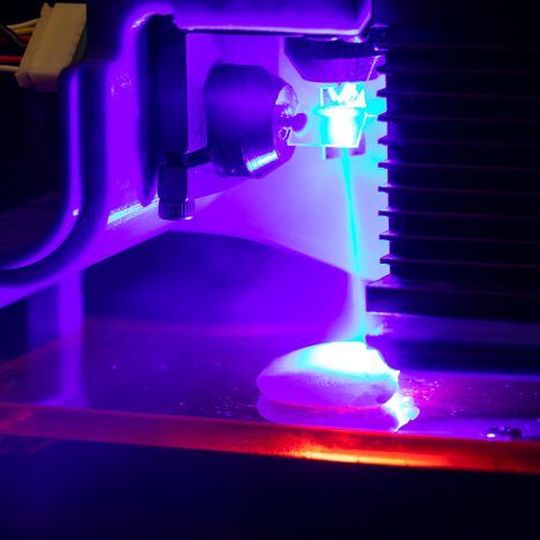 Chicken being cooked by a blue laser. Light is being directed by two software-controlled mirror galvanometers. Chicken being cooked by a blue laser. Light is being directed by two software-controlled mirror galvanometers.