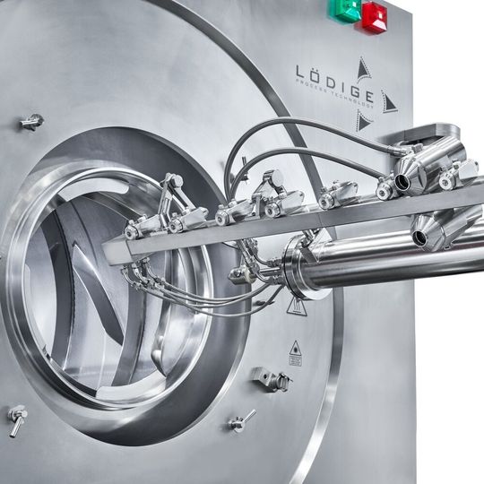 Coater with extended nozzle arm, view from below. Coater with extended nozzle arm, view from below.
