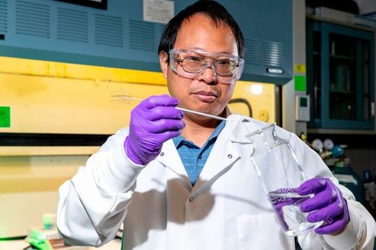 Sandia National Laboratories researcher Guangping Xu adds coal ash into a citric acid mixture. This solution will be fed into a reactor — operating at about 70 times atmospheric pressure — where supercritical carbon dioxide aids citric acid in extracting rare-earth metals. Sandia National Laboratories researcher Guangping Xu adds coal ash into a citric acid mixture. This solution will be fed into a reactor — operating at about 70 times atmospheric pressure — where supercritical carbon dioxide aids citric acid in extracting rare-earth metals.