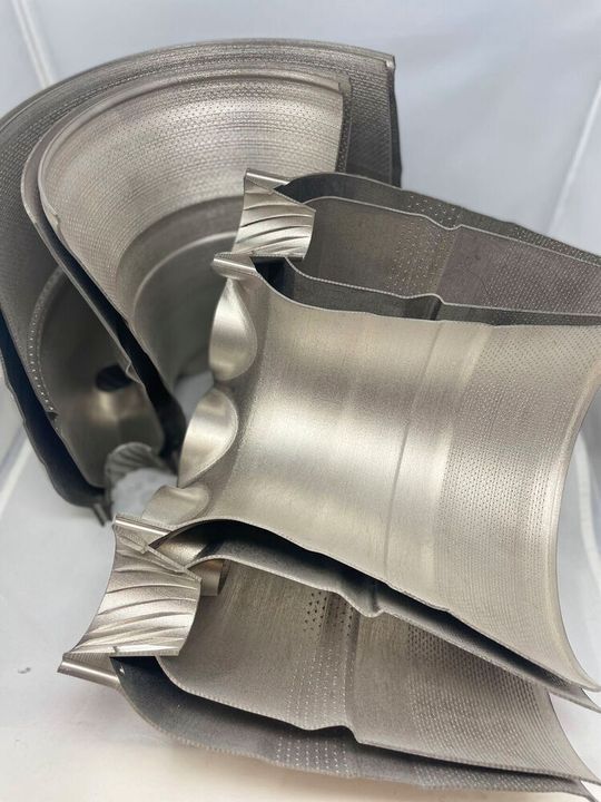 A combustor liner made using Amperprint 0233 Haynes 282 powder from Höganäs. The part features 23,000 unique holes for optimized air-to-fuel ratios and internal channels for regenerative cooling. The part is shown as printed, with no supports. A combustor liner made using Amperprint 0233 Haynes 282 powder from Höganäs. The part features 23,000 unique holes for optimized air-to-fuel ratios and internal channels for regenerative cooling. The part is shown as printed, with no supports.