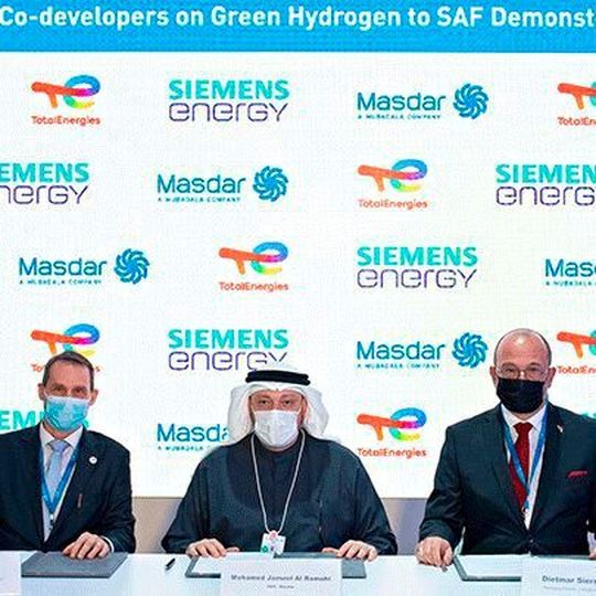 Representatives of Total Energies, Masdar and Siemens Energy sign a collaboration agreement to act as co-developers on green hydrogen project. Representatives of Total Energies, Masdar and Siemens Energy sign a collaboration agreement to act as co-developers on green hydrogen project.