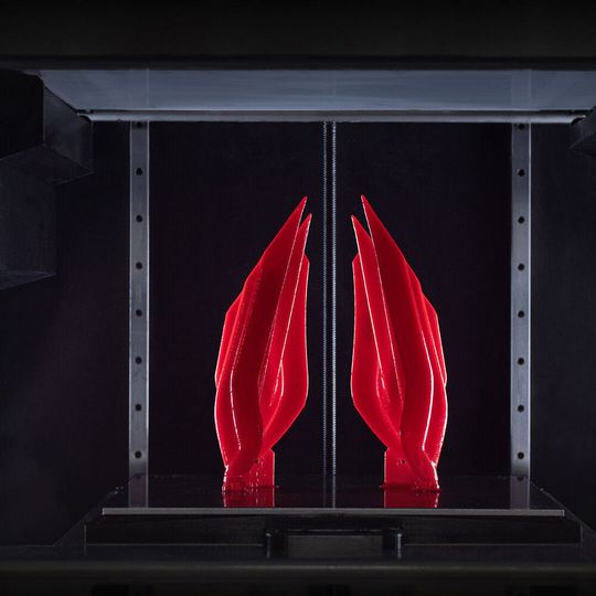 VLM is a patented lithography-based 3D printing process that laminates thin layers of high viscosity resins onto a transparent transfer film. VLM is a patented lithography-based 3D printing process that laminates thin layers of high viscosity resins onto a transparent transfer film.